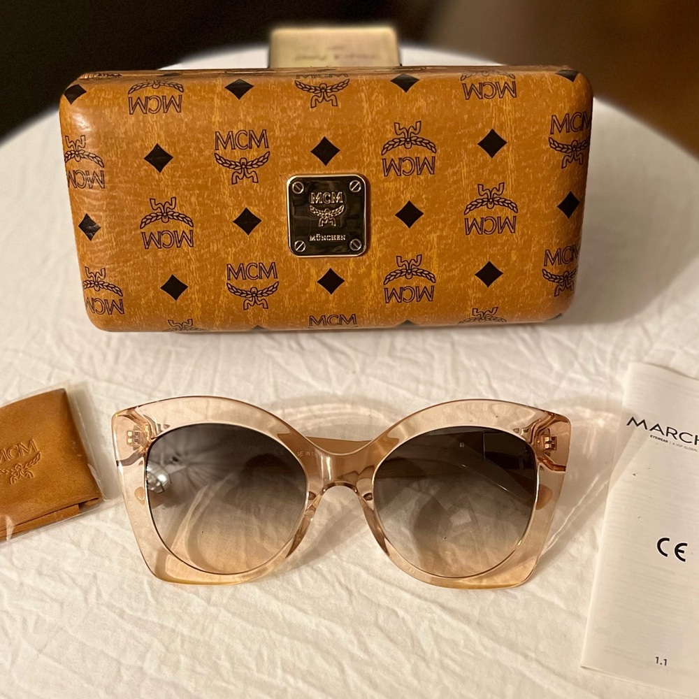 MCM Authentic/Pre-loved, oversized frames. MCM on the arms of glasses.